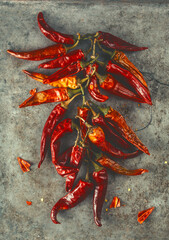 Dry red hot pepper on an old surface