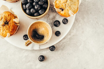 Cup of coffee and Homemade muffins. Food background with copy space for your text.