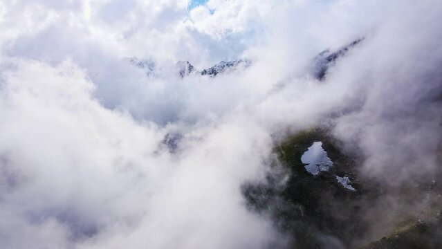 Aerial: Clouds on the slopes of Mount Elbrus in the morning