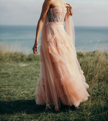 Happy young hispanic bride wears pink dress. - 615931155