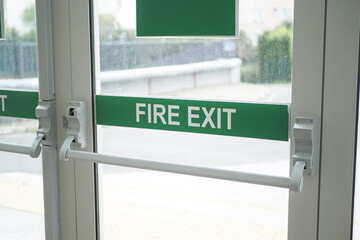 exit sign on brick wall 