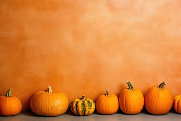 Naklejka na ściany i meble Pumpkins on an orange background, autumn harvest. Background with copy space. AI generative.