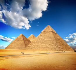 Fototapeta na wymiar Pyramids of Giza in the desert by day