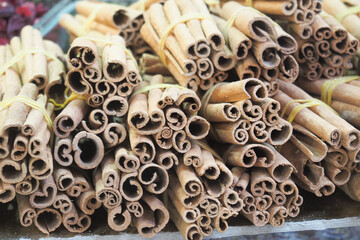 Obraz na płótnie Canvas stack of Cinnamon sticks selling at local shop in turkey 