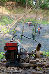 Fototapeta na wymiar Water pump machine used in agriculture field irrigation 