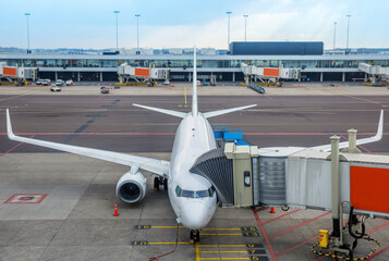 Fototapeta premium boarding of an modern airplane at the gate