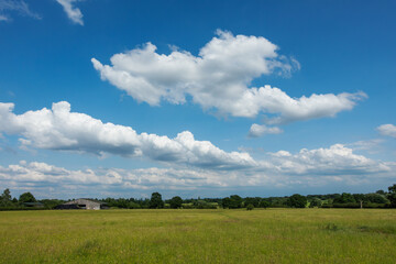 Blue sky background with a tiny clouds
- 615935357