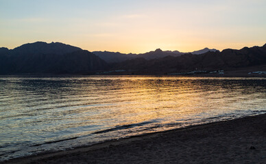 Beautiful sunset with orange sky in Lagoona beach, Dahab, Egypt