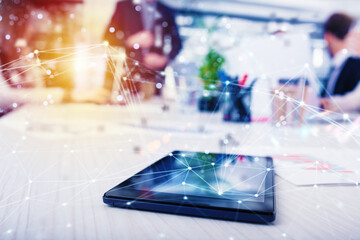 Tablet on a table that shares multimedia with internet connection