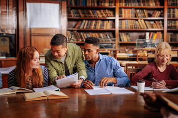 Students doing assignment in library.