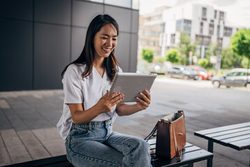 Young Japanese woman using digital tablet