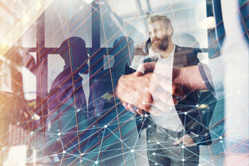 Handshaking business person in the office with network effect. concept of teamwork and business partnership. double exposure