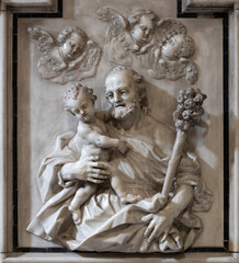 NAPLES, ITALY - APRIL 20, 2023: The marble relief of St. Joseph in church Basilica di Santa Maria degli Angeli a Pizzofalcone by unknown artist.