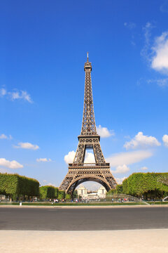 Famous landmark of Paris - Eiffel tower, Champ-de-mars, Paris, France. Summer day