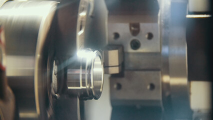 Manufacture of metal parts on the machine at the factory, close-up