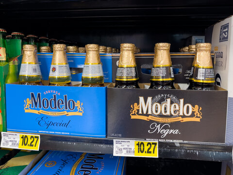 ATLANTA, GEORGIA - JUNE 22, 2023 : Modelo Especial and Modelo Negra beer bottle 6 packs on store shelf. Modelo Especial is one of the top selling imported Mexican beers sold in the United States.