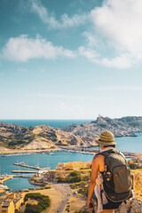 Obraz premium vertical traveler and tourist woman enjoy panoramic view of island and sea in summer sunset with freedom and wisdom in marseille france