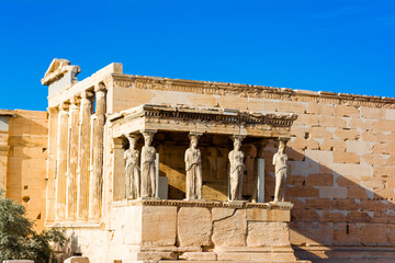 The Porch of the Caryatids at the Erechtheion temple on the Acropolis, Athens, Greece. Six columns...