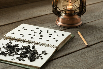 a lot of small black Latin letters scattered across the pages of a notebook, the concept of grammar...