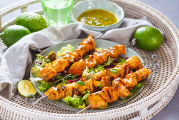 Chicken skewers with mint-lime dipping sauce. BBQ. Summer food.