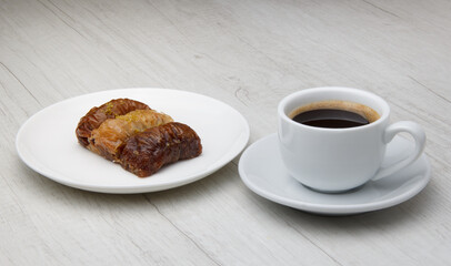 sweet oriental baklava and a mug of strong fragrant coffee. selective focus 