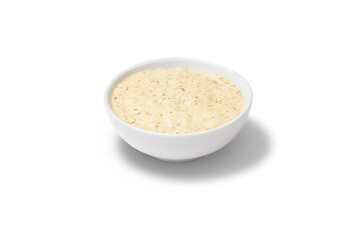 Peanut sauce in a gravy boat. White background