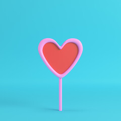 Fototapeta na wymiar Pink with red heart on a stick on bright blue background in pastel colors. Minimalism concept. 3d render
