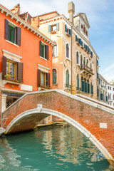 Fototapeta na wymiar Stone bridge over the canal in Venice, Italy, Europe.