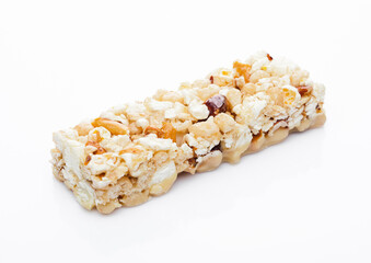 Popcorn Caramel protein cereal energy bar with nuts on white background