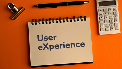 There is notebook with the word User eXperience. It is as an eye-catching image.
