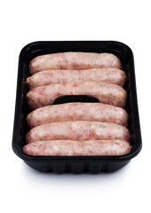 Plastic tray of raw pork beef sausages isolated on white