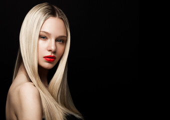 Beauty fashion model portrait with shiny blonde hairstyle with red lips on black background