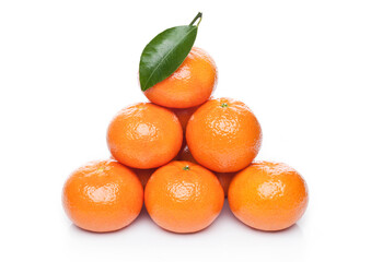 Fresh organic mandarins tangerines fruits with leaves on white background