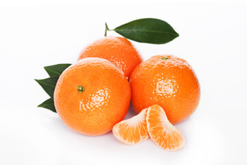Fresh organic mandarins tangerines fruits with leaves on white background