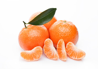 Fresh organic mandarins tangerines fruits with leaves on white background