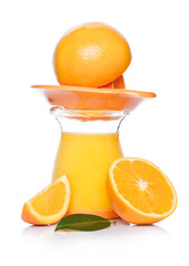 Fresh raw peeled oranges with juice squeezer jar with leaves on white background