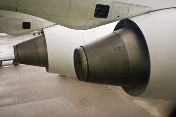 A pair of jet engines on the tarmac, back view