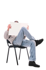 man in a chair with a magazine on a white background