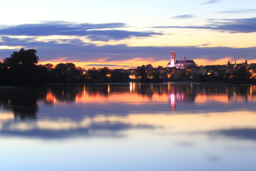 Fototapeta na wymiar Cathedral and river Loire in the sunset, Nevers, Burgundy, France