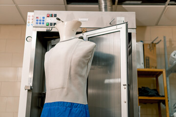 ironing mannequin for clothes in an industrial hotel laundry concept of cleanliness and hospitality...