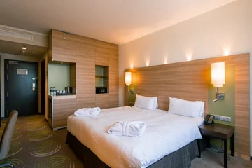 Fototapete Hotel Chic interior of a double hotel room after cleaning housekeeping bedroom rest room concept of cleanliness and hospitality travel rest  © Guys Who Shoot