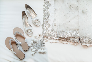 The indian bride shoes and saree on white background
