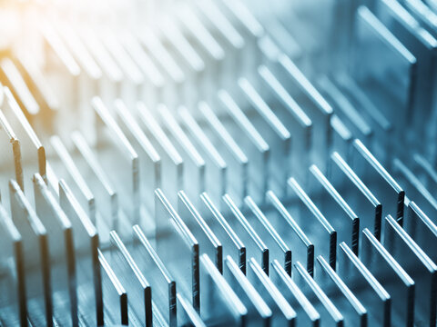 Metallic heatsink close up: hardware and computer electronics - Powered by Adobe
