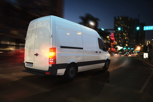 Moving truck on a city road with skyscrapers background. 3D Rendering