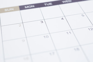 Closeup of dates on blank calendar page. Simple timetable planning for appointment schedule and...