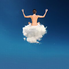 Young girl practices yoga over a soft cloud
