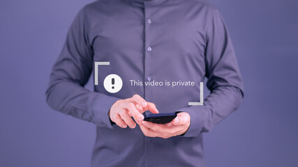 Young man using a smartphone to play social media but this video is blocked or privacy settings have been set. Searching for more internet, and search engine optimization. Subscribing and following.