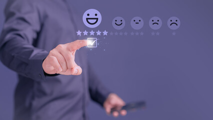 Customer touching the virtual screen on the smile face icon and five stars to give satisfaction in service. Opinion rating very impressed. Assessment testimonial customer service and feedback concept.