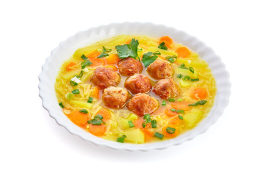 Meatballs in the potato soup. On a white background