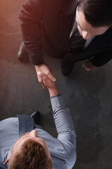 Handshaking business person in the office. concept of teamwork and business partnership